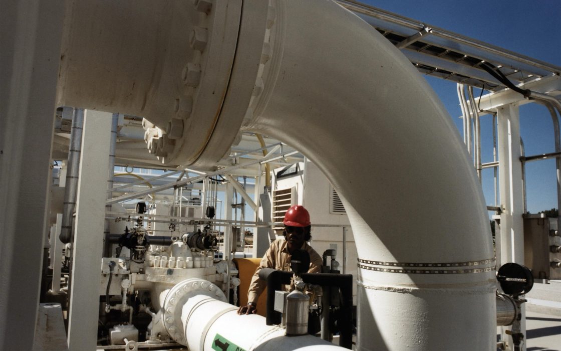 Large white crude oil pipes and valves at a Strategic Petroleum Reserve storage site