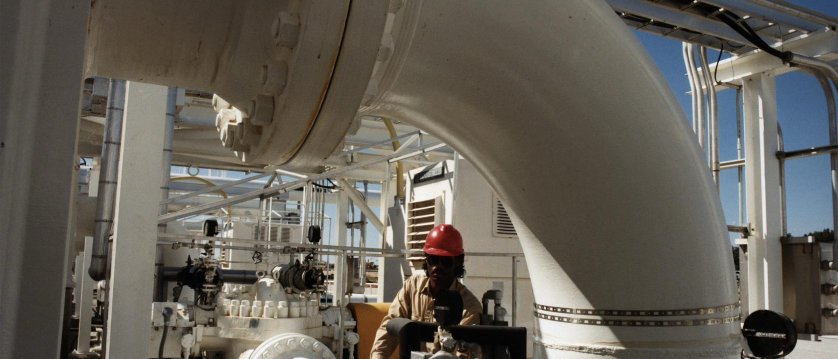 Large white crude oil pipes and valves at a Strategic Petroleum Reserve storage site