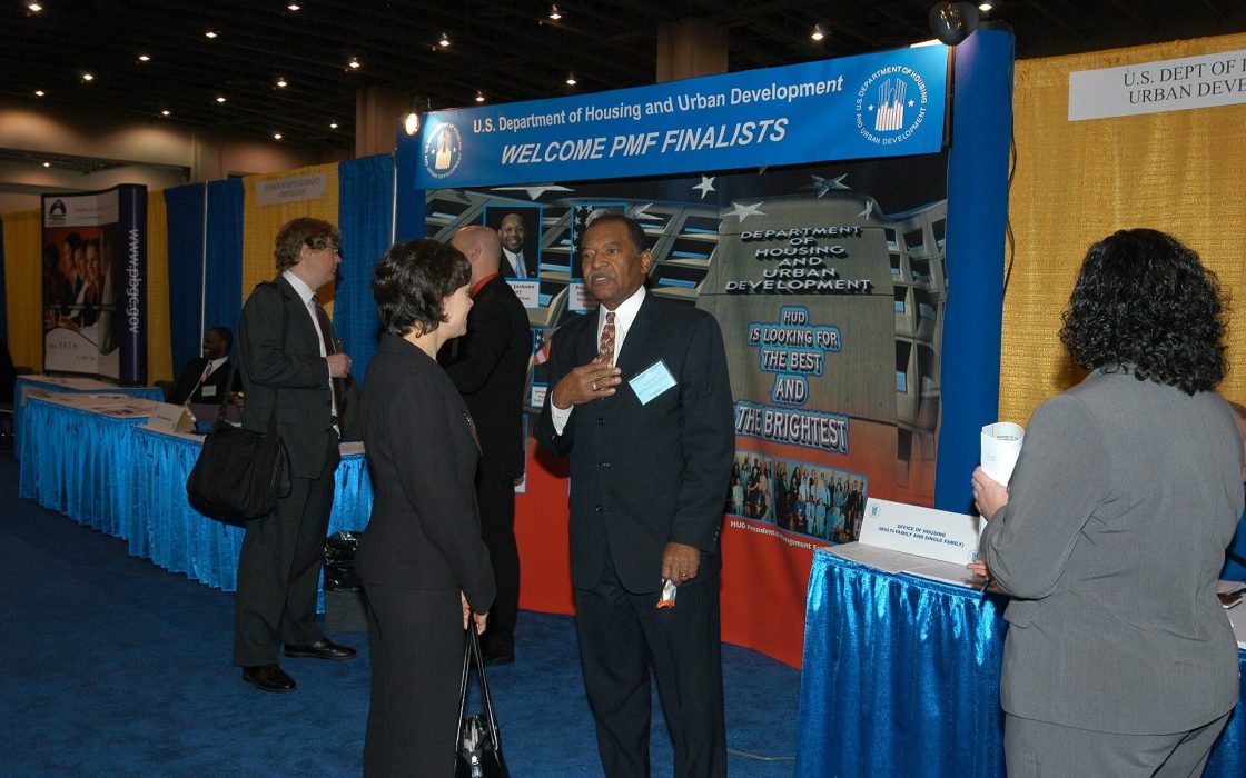HUD Displays, Staff at Job Fair - (HUD representatives, displays, promotions for) Presidential Management Fellows (PMF) Program at Job Fair, Washington, D.C. Convention Center - DPLA - 88ab2acf9ff240fba986e70fd3102d42