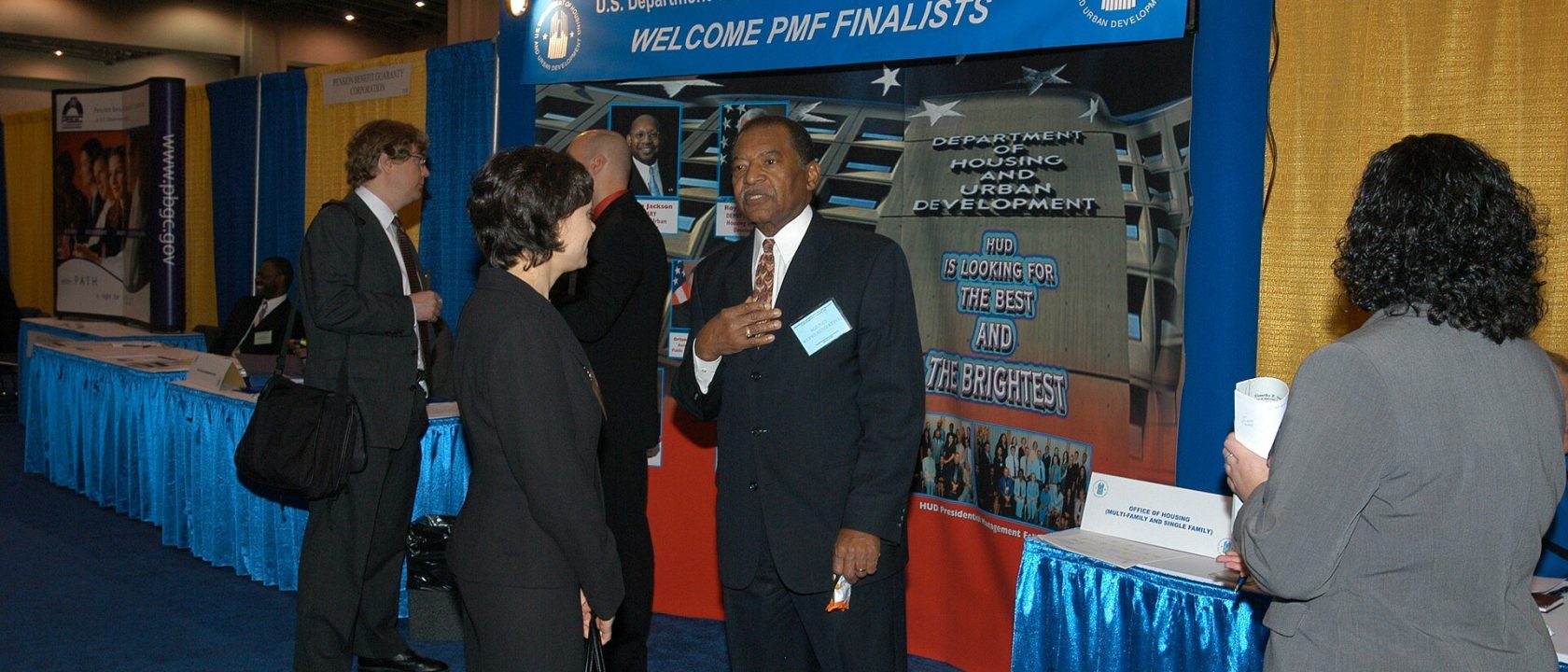 HUD Displays, Staff at Job Fair - (HUD representatives, displays, promotions for) Presidential Management Fellows (PMF) Program at Job Fair, Washington, D.C. Convention Center - DPLA - 88ab2acf9ff240fba986e70fd3102d42